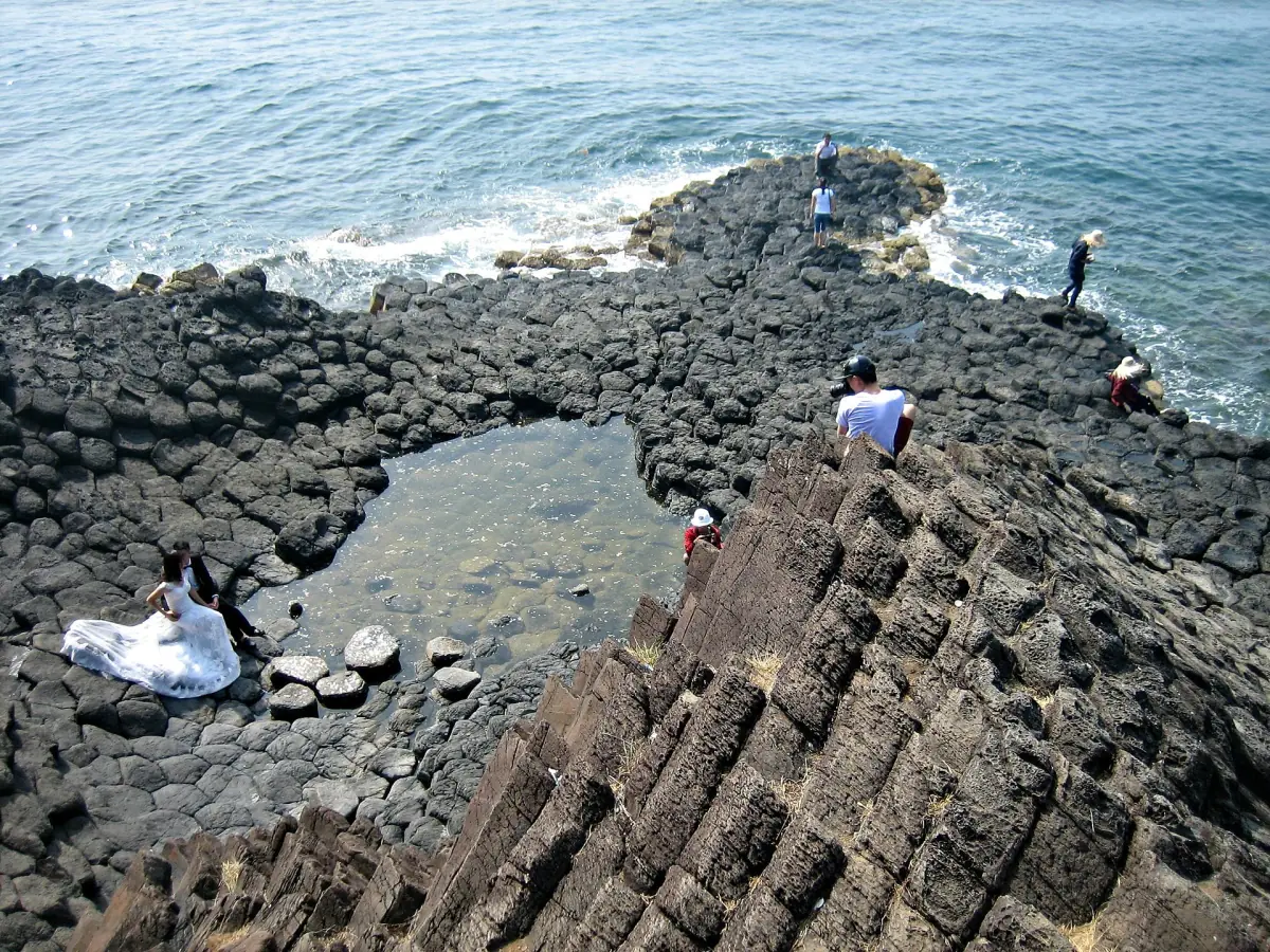 A tide pool between hexagonal basalt columns at Ganh Da Dia